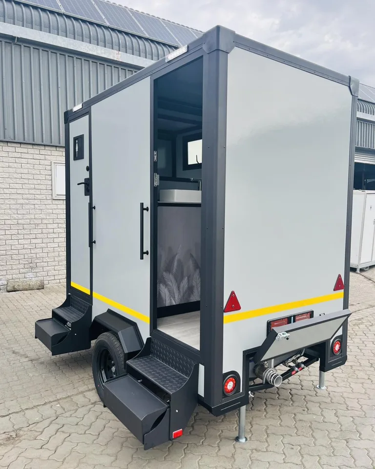 Open entrance and steps on a compact restroom trailer